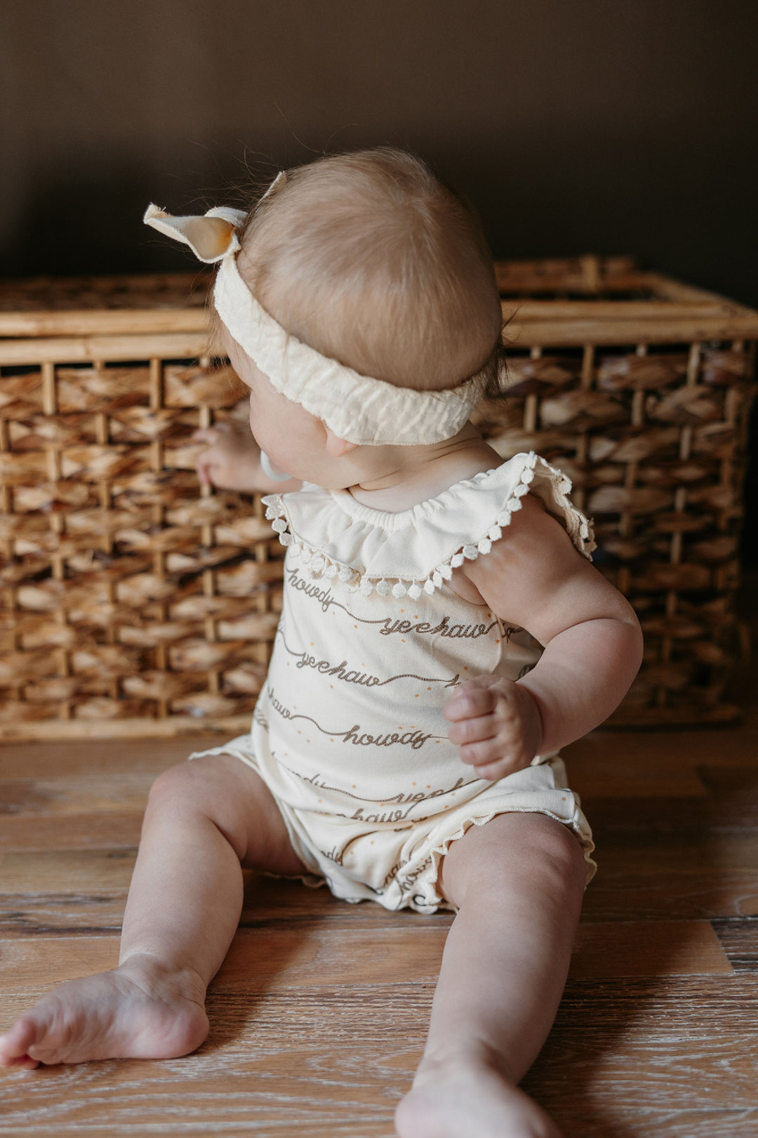Child wearing Organic Bubble Romper in Howdy.