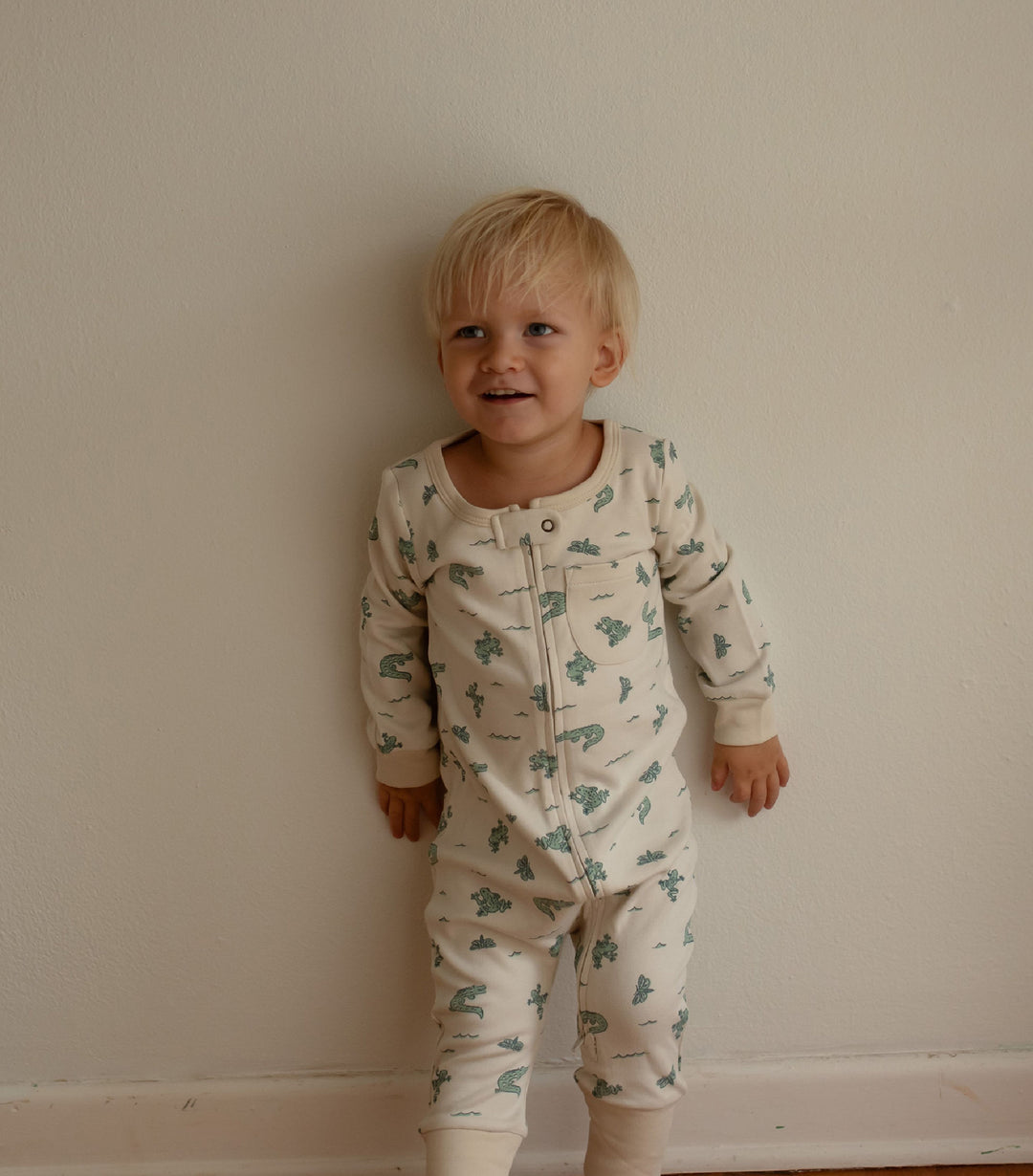 Child wearing Organic Footless 2-Way Zipper Romper in Alligator.