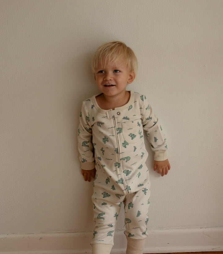 Child wearing Organic Footless 2-Way Zipper Romper in Alligator.