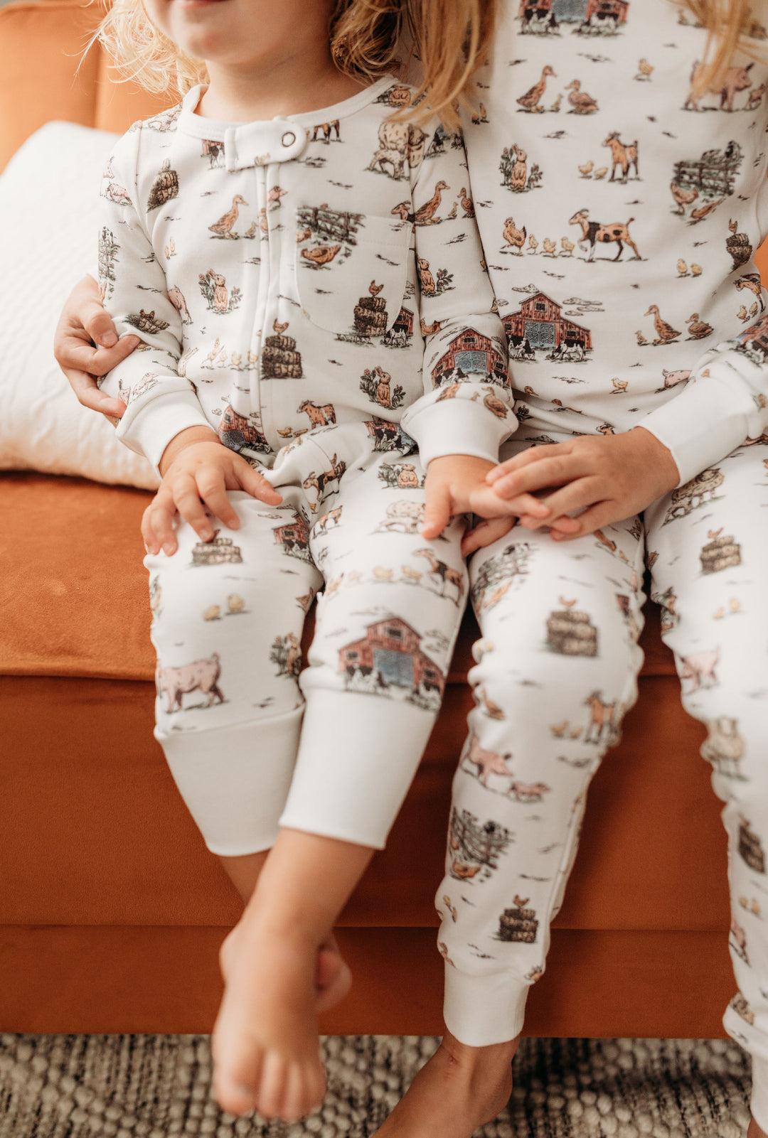 Child wearing Organic Footless 2-Way Zipper Romper in Farm Friends.