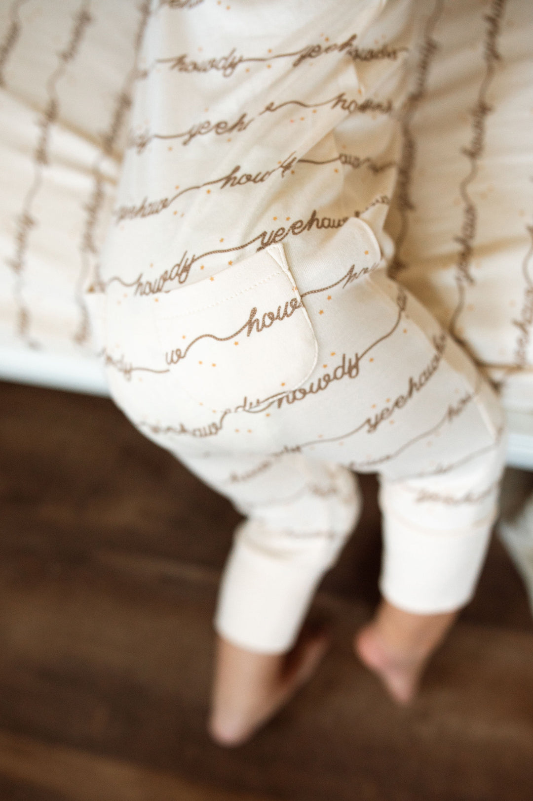 Child wearing Organic Footless 2-Way Zipper Romper in Howdy.