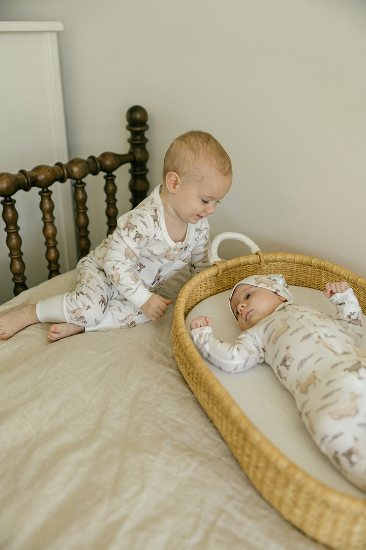 Child wearing Organic Footless 2-Way Zipper Romper in Llama.