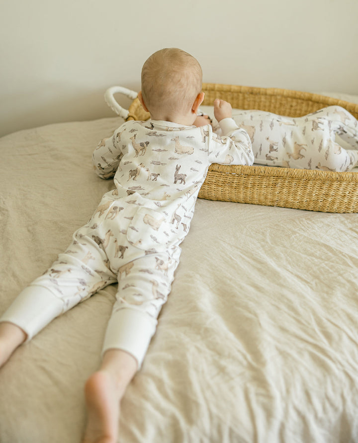 Child wearing Organic Footless 2-Way Zipper Romper in Llama.