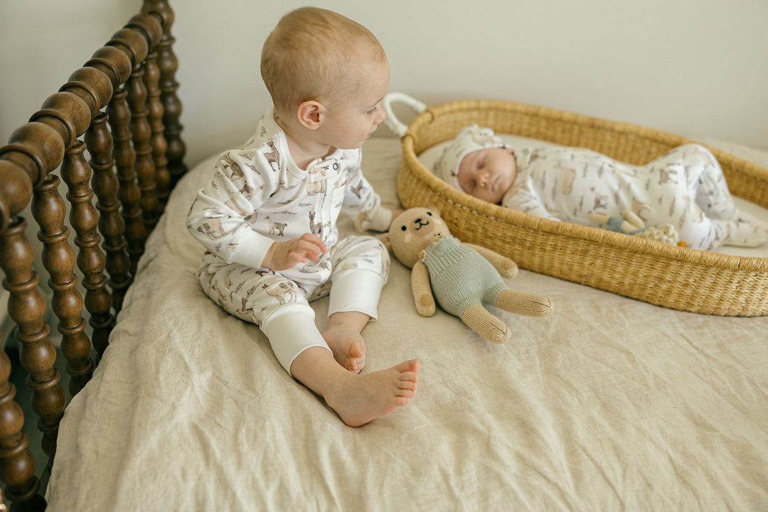 Child wearing Organic Footless 2-Way Zipper Romper in Llama.