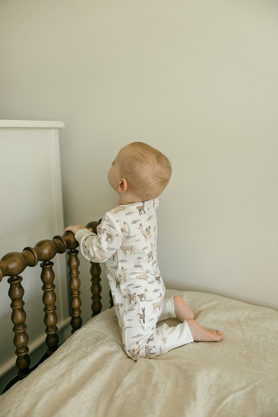 Child wearing Organic Footless 2-Way Zipper Romper in Llama.