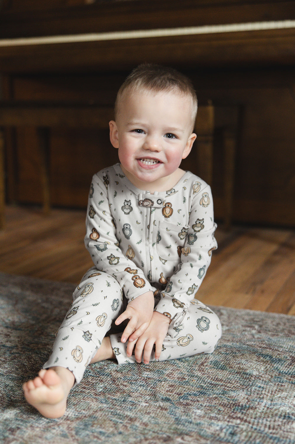Child wearing Organic Footless 2-Way Zipper Romper in Owl Hoo?.