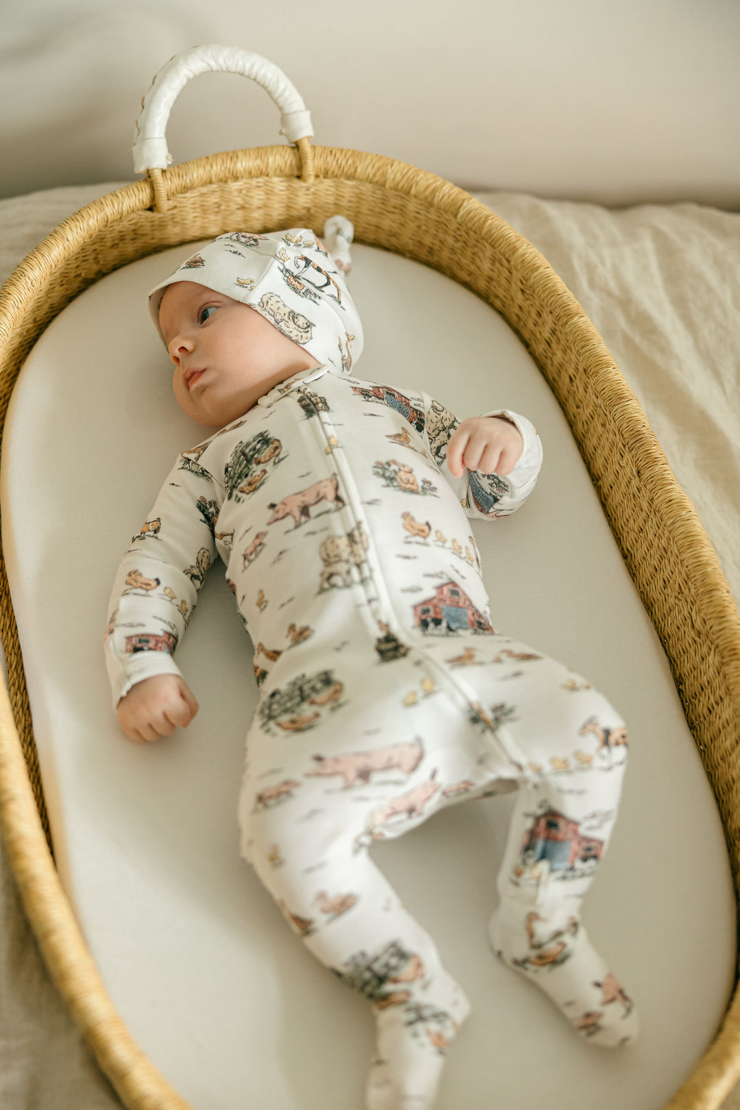 Child wearing Organic 2-Way Zipper Footie in Farm Friends.