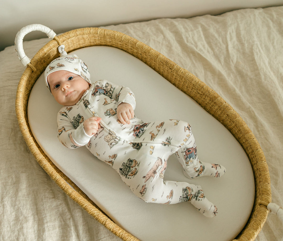 Child wearing Organic 2-Way Zipper Footie in Farm Friends.