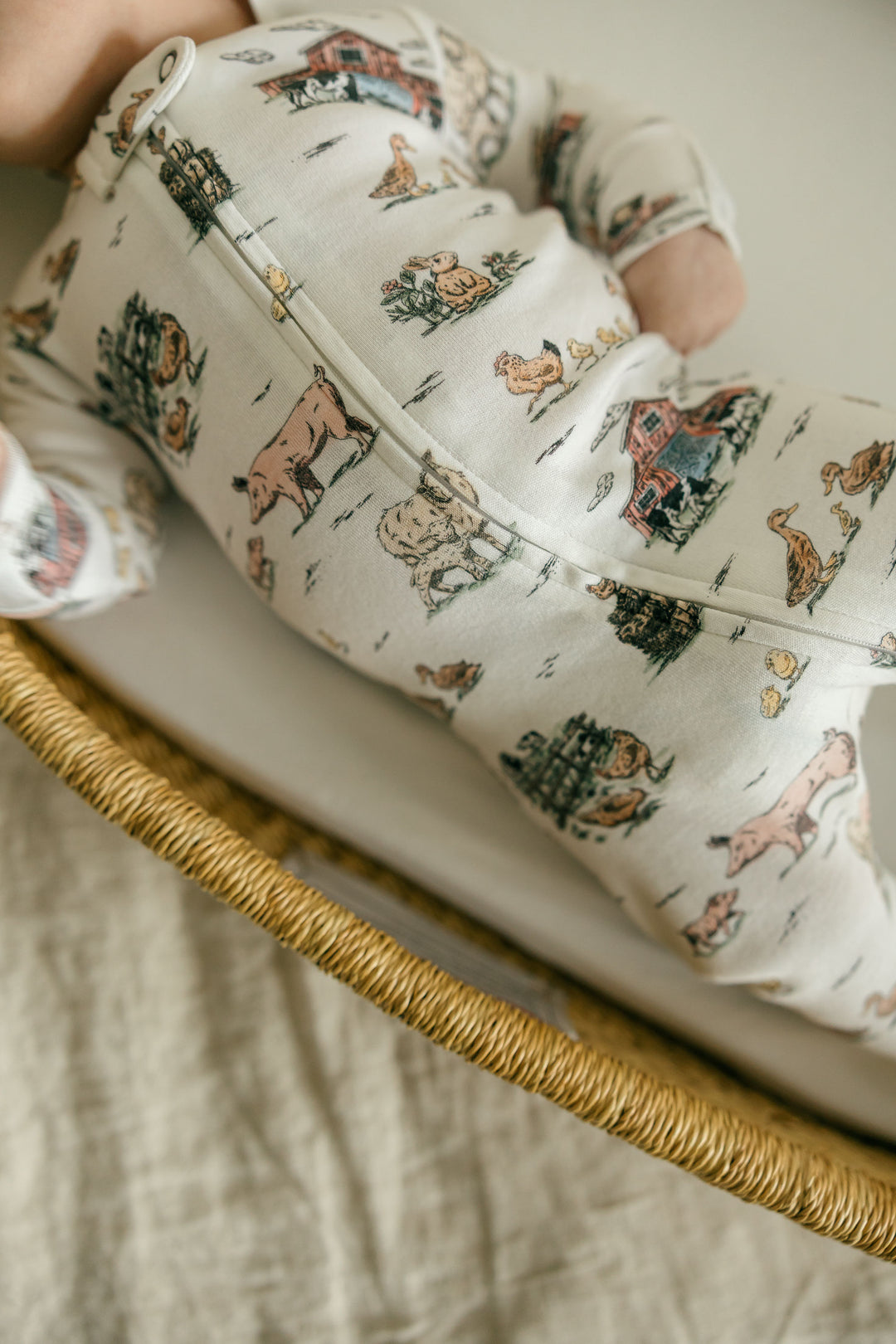 Child wearing Organic 2-Way Zipper Footie in Farm Friends.