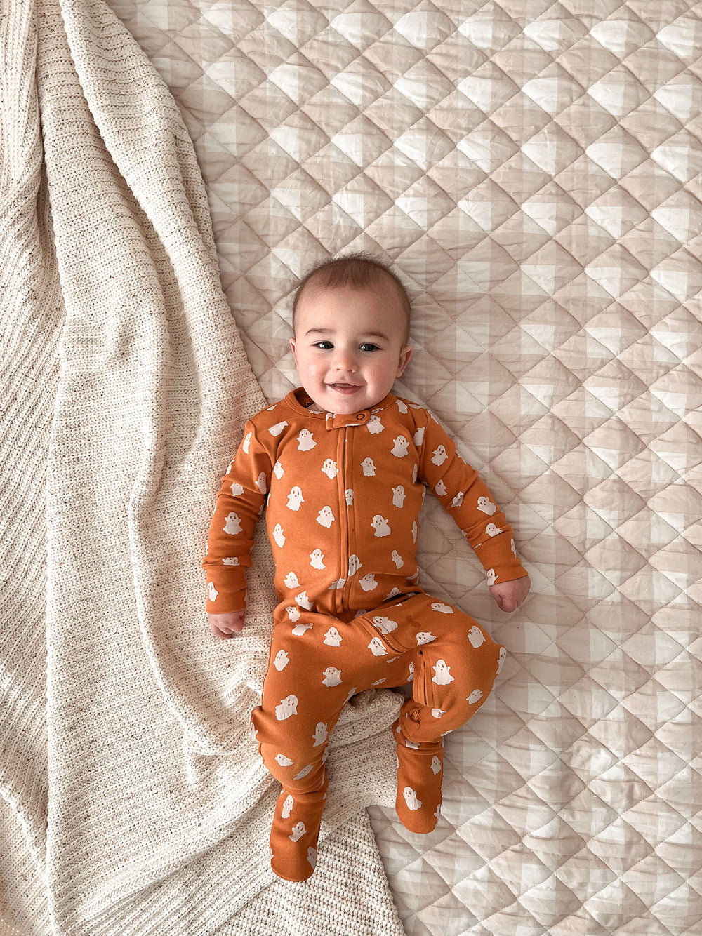 Child wearing Organic 2-Way Zipper Footie in Ghosts.