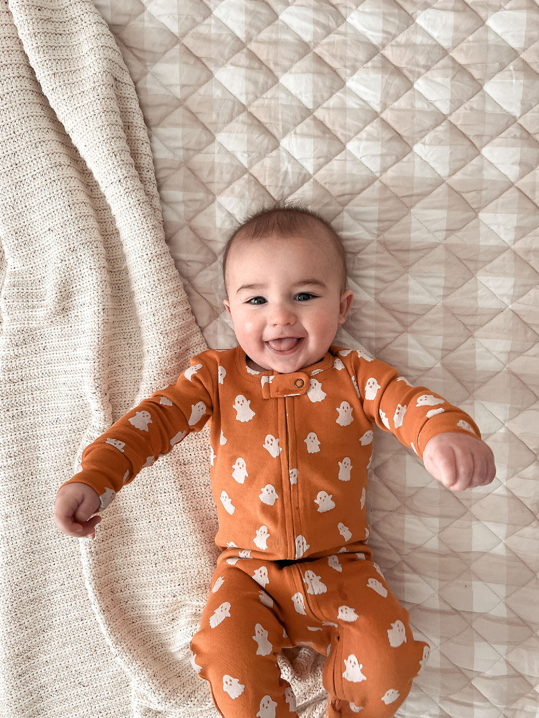 Child wearing Organic 2-Way Zipper Footie in Ghosts.