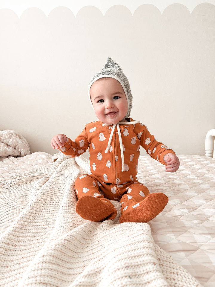 Child wearing Organic 2-Way Zipper Footie in Ghosts.
