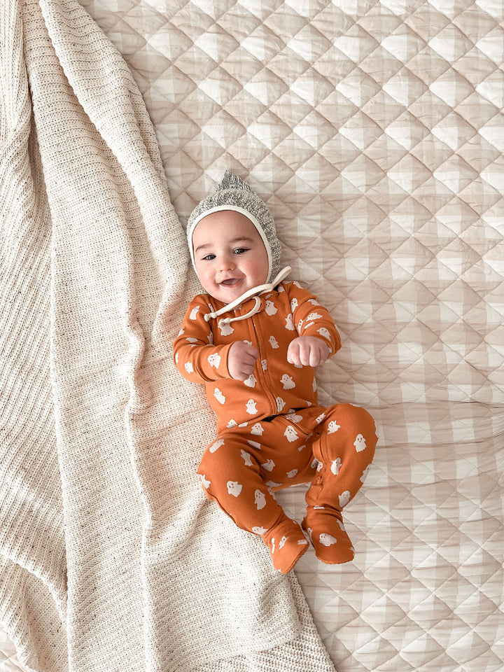 Child wearing Organic 2-Way Zipper Footie in Ghosts.