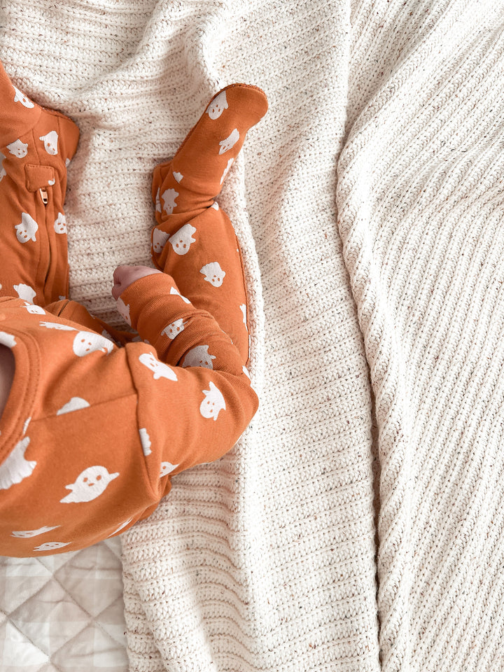 Child wearing Organic 2-Way Zipper Footie in Ghosts.