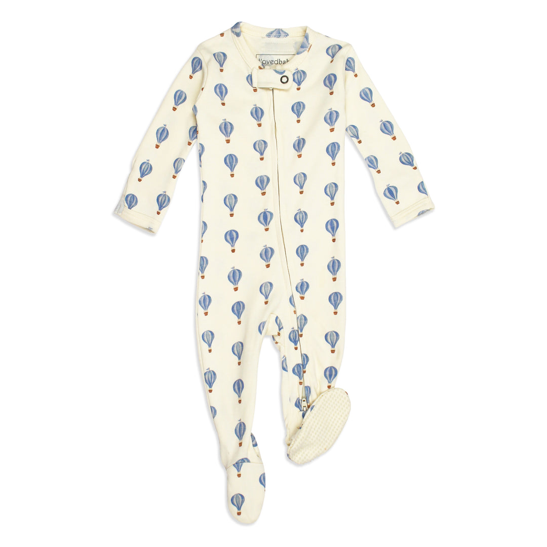 flat image of organic zipper footie in blue hot air ballon print