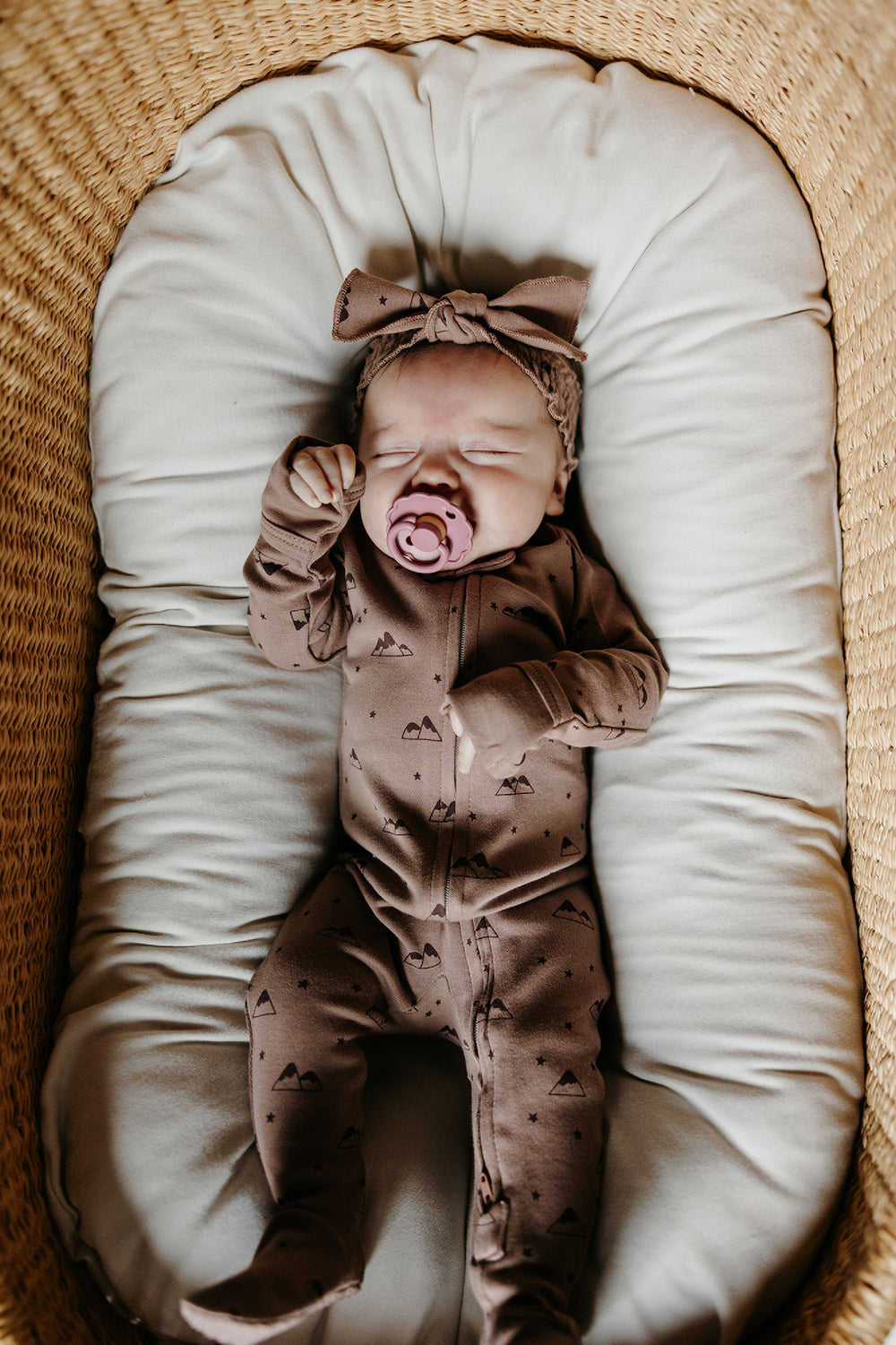 Child wearing Organic 2-Way Zipper Footie in Latte Mountain.