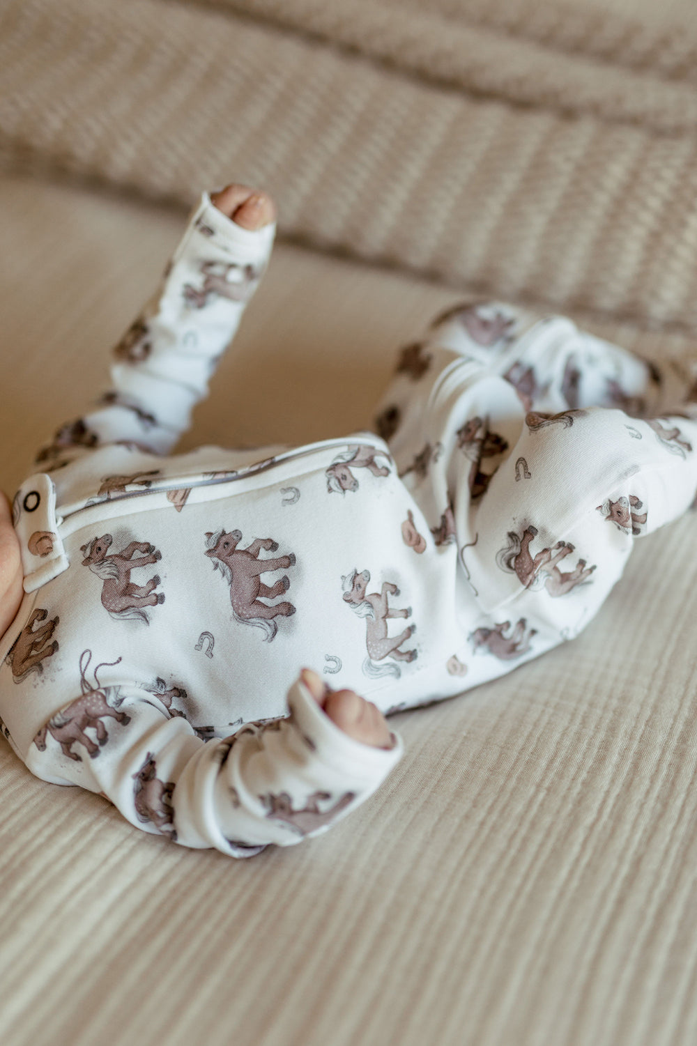 Child wearing Organic 2-Way Zipper Footie in Little Lasso.