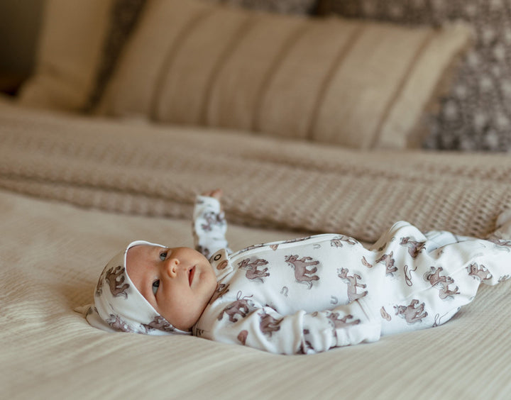 Child wearing Organic 2-Way Zipper Footie in Little Lasso.