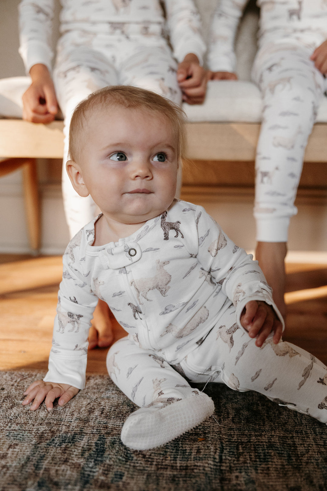 Child wearing Organic 2-Way Zipper Footie in Llama.