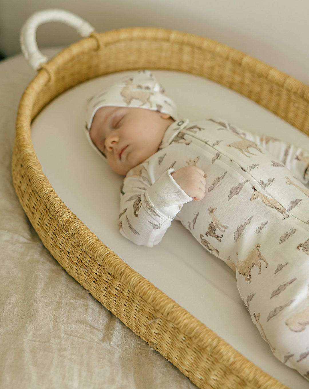 Child wearing Organic 2-Way Zipper Footie in Llama.