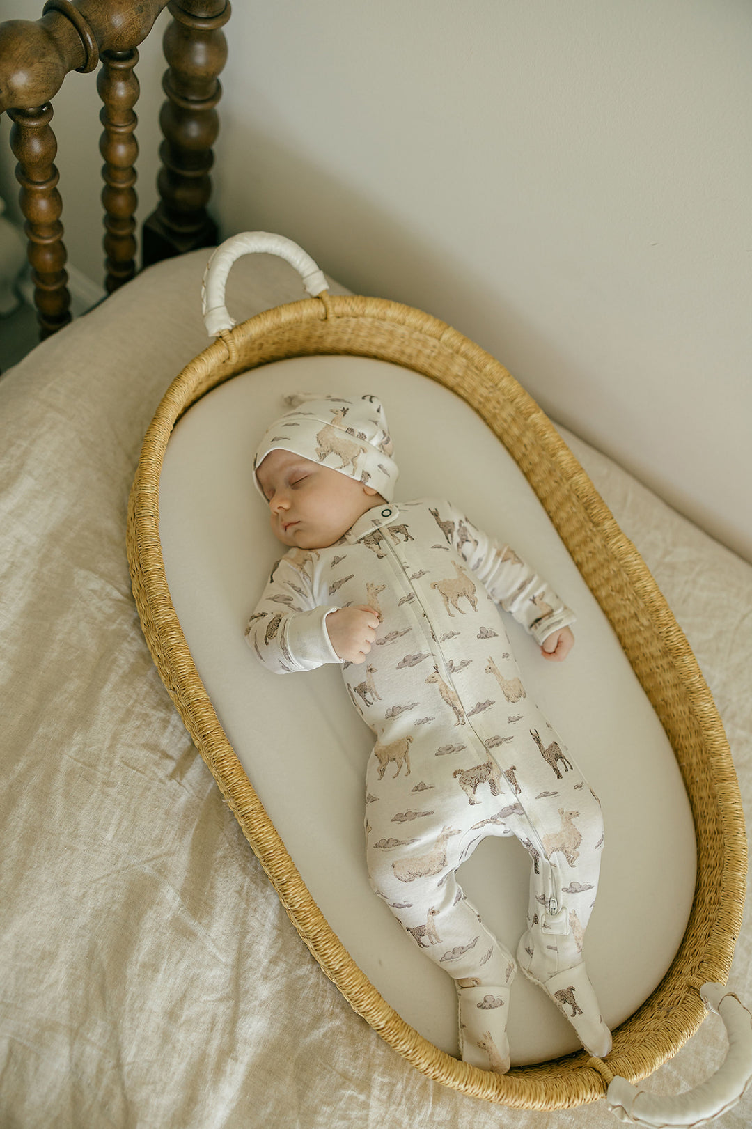 Child wearing Organic 2-Way Zipper Footie in Llama.