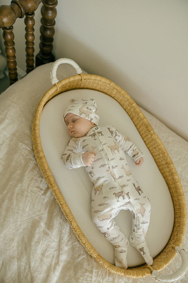 Child wearing Organic 2-Way Zipper Footie in Llama.