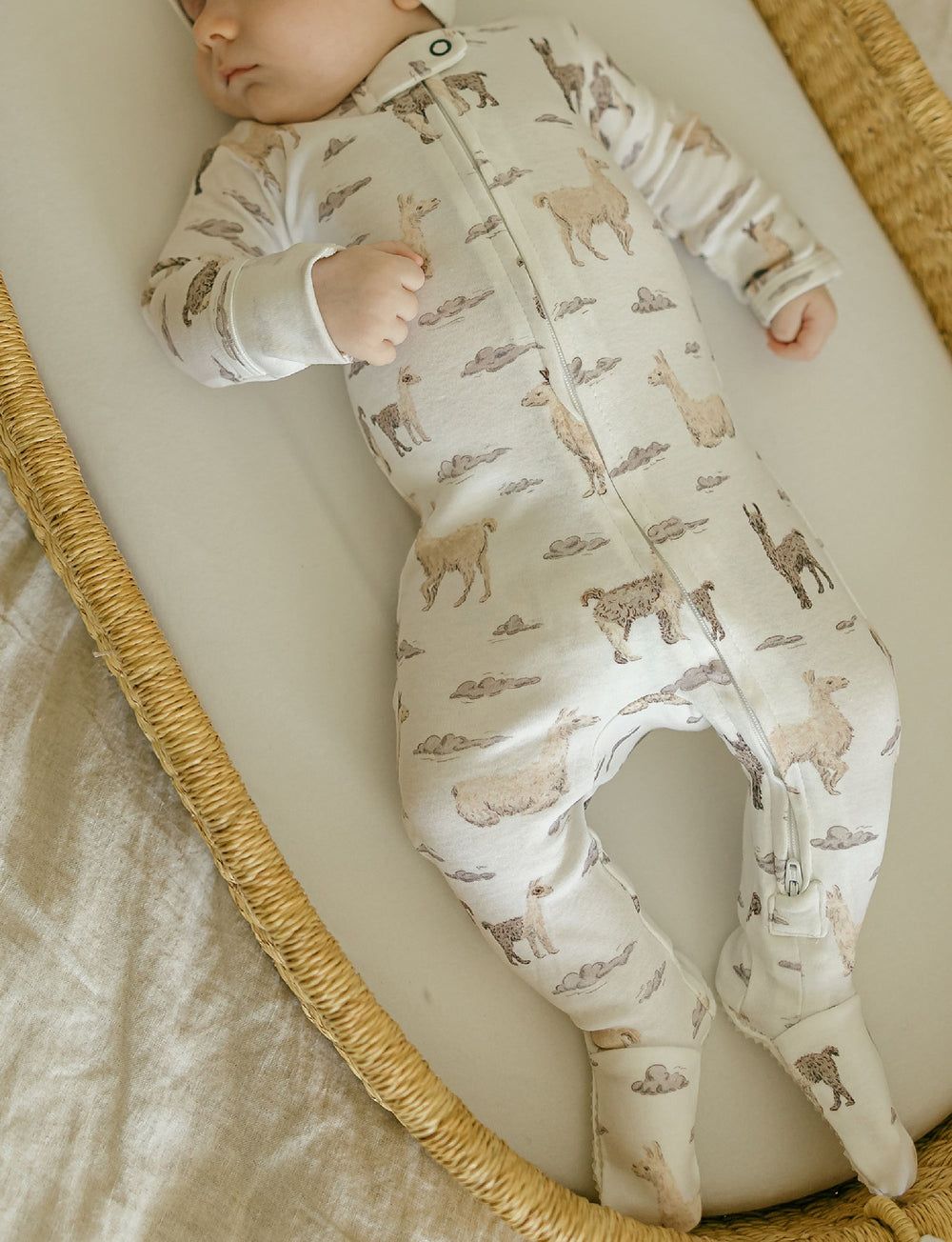 Child wearing Organic 2-Way Zipper Footie in Llama.