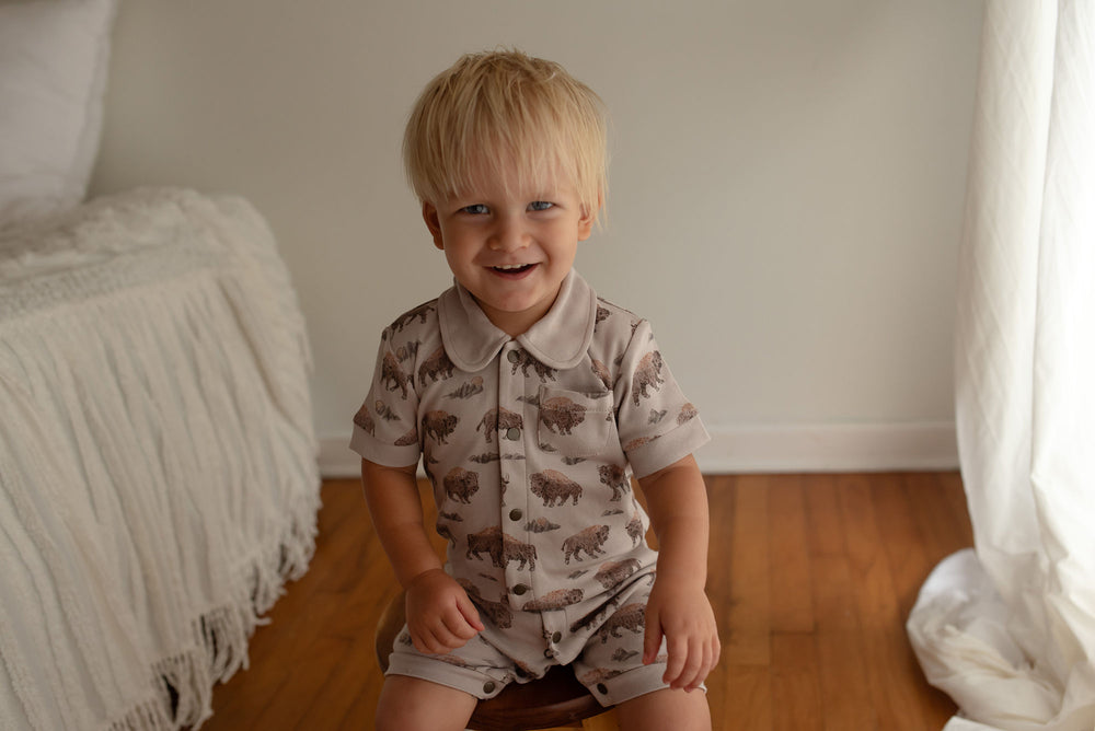 Child wearing Organic S/Sleeve Coverall in Bison.