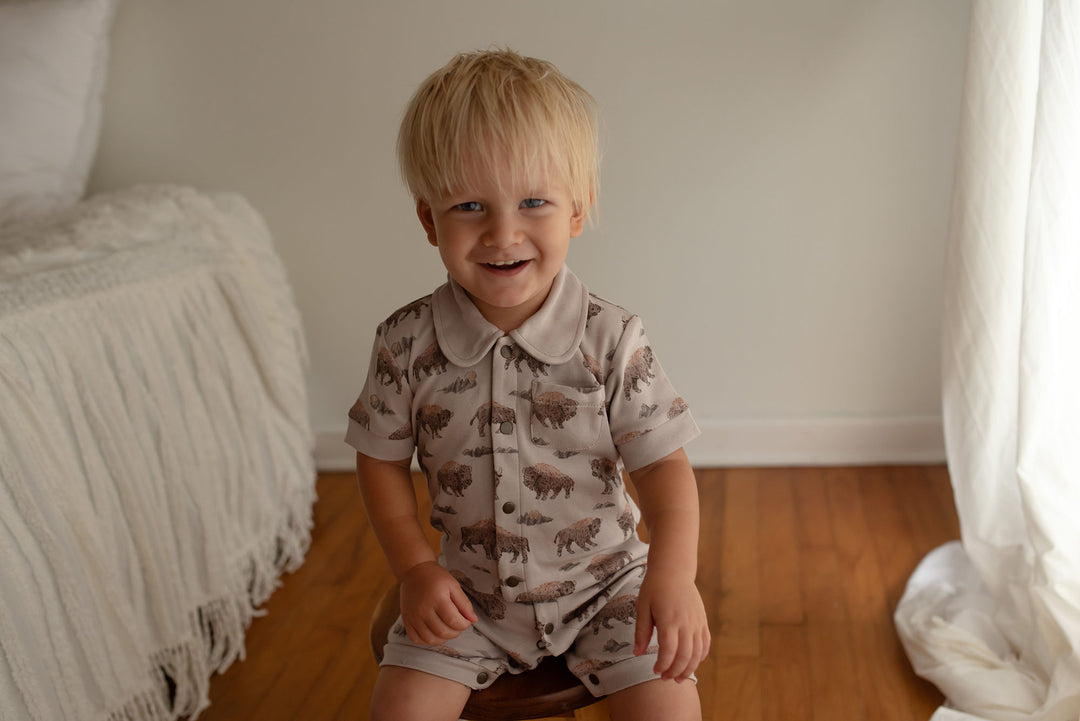 Child wearing Organic S/Sleeve Coverall in Bison.