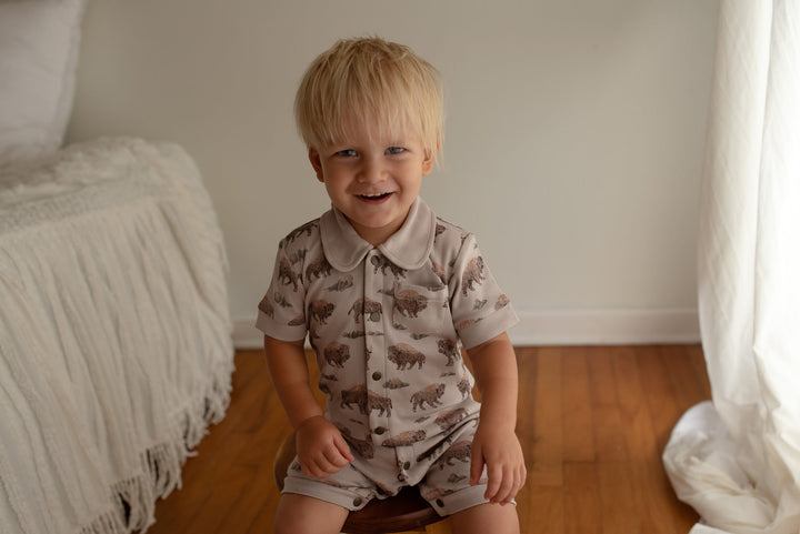 Child wearing Organic S/Sleeve Coverall in Bison.
