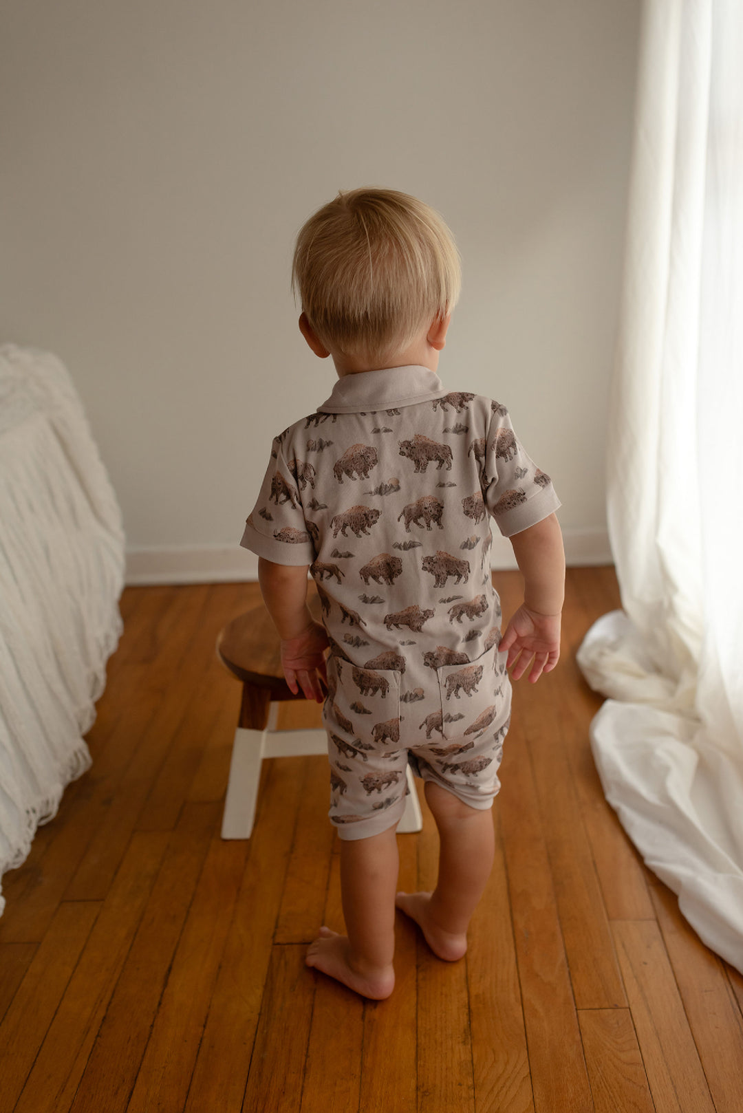 Child wearing Organic S/Sleeve Coverall in Bison.