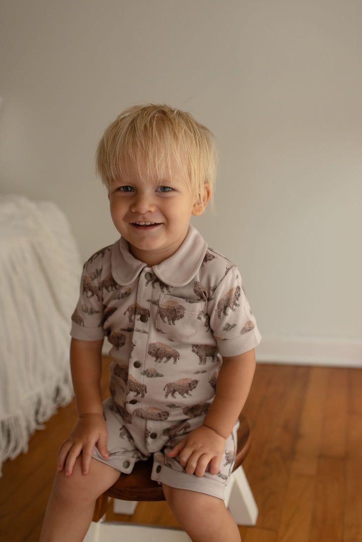 Child wearing Organic S/Sleeve Coverall in Bison.