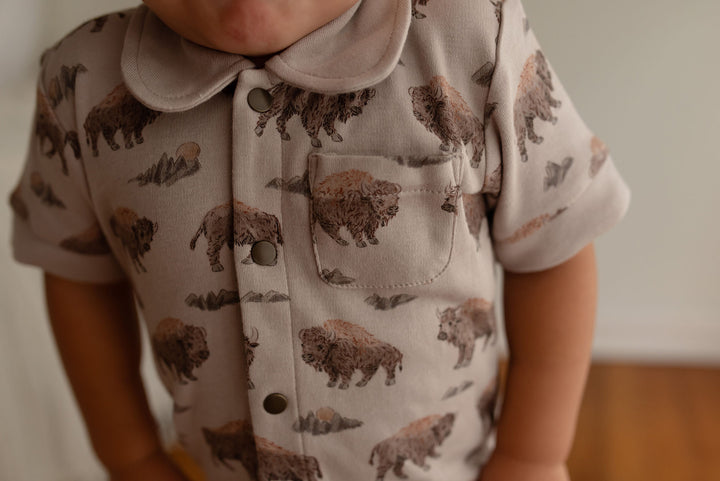 Child wearing Organic S/Sleeve Coverall in Bison.
