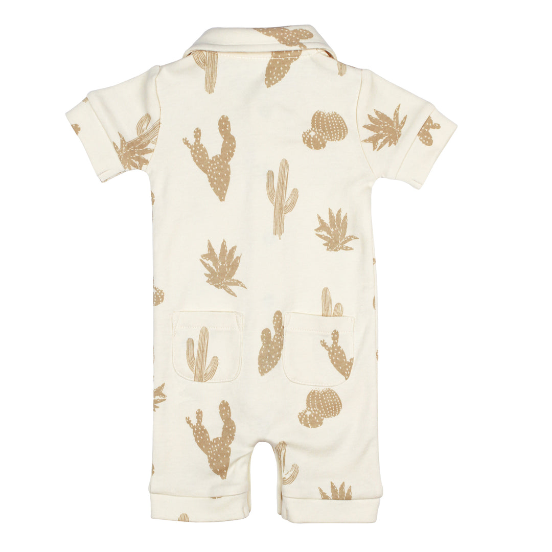 Flat photo showing back side of S/Sleeve Coverall with buttercream base fabric and oatmeal colored cactus print