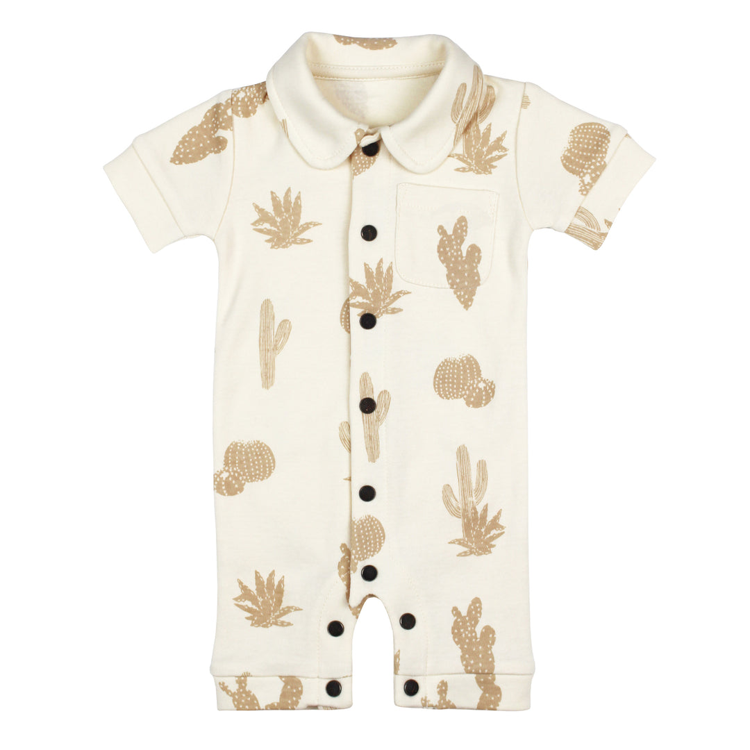 Flat photo showing front side of S/Sleeve Coverall with buttercream base fabric and oatmeal colored cactus print