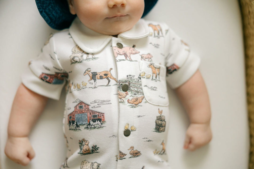 Child wearing Organic S/Sleeve Coverall in Farm Friends.
