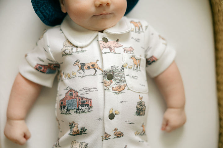 Child wearing Organic S/Sleeve Coverall in Farm Friends.
