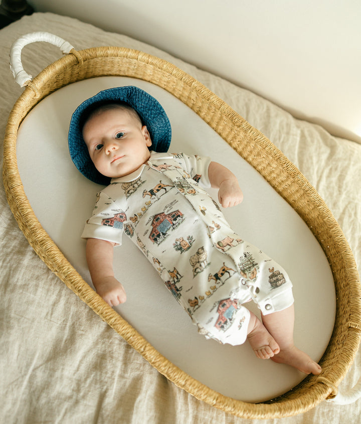 Child wearing Organic S/Sleeve Coverall in Farm Friends.