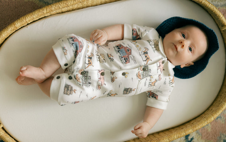 Child wearing Organic S/Sleeve Coverall in Farm Friends.