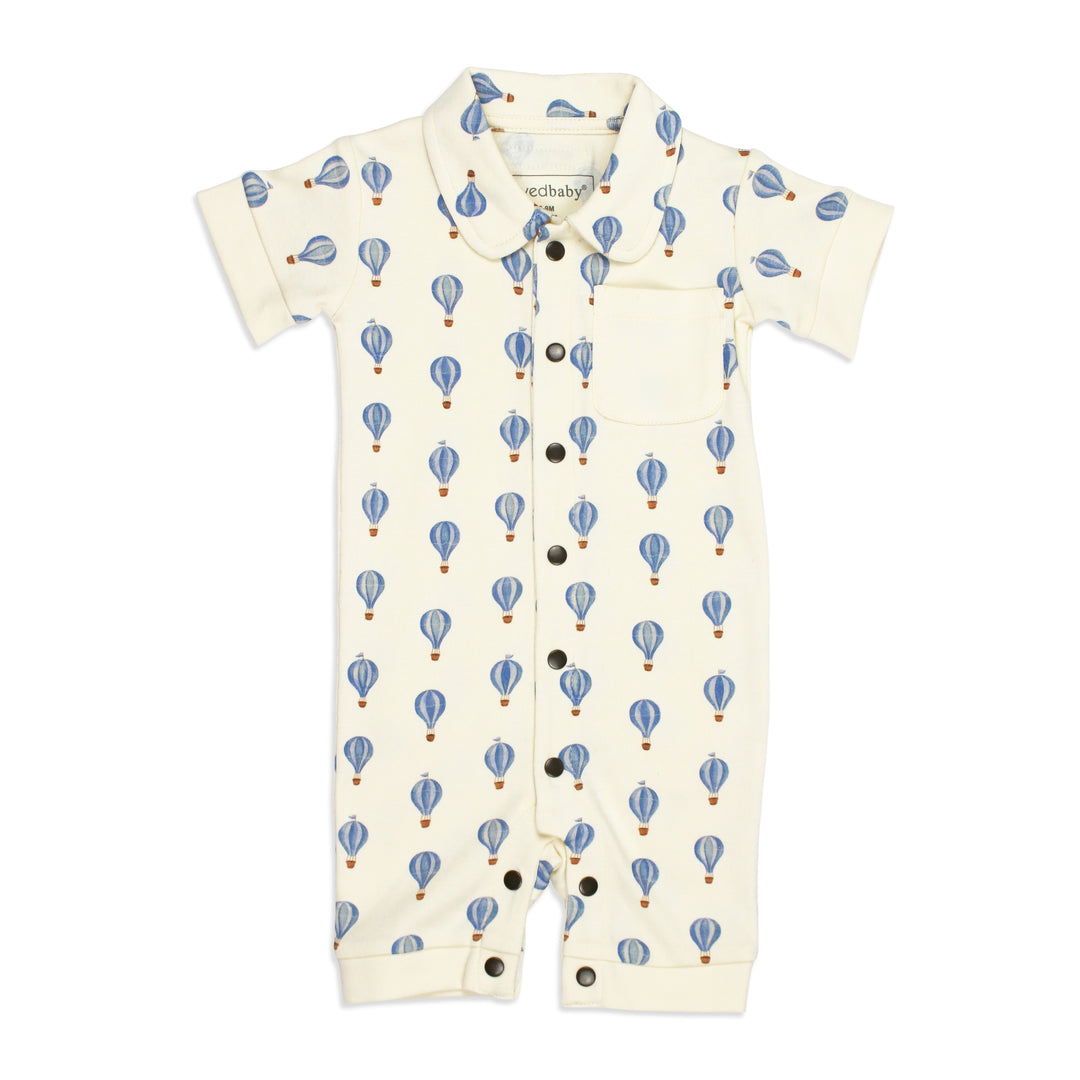 flat image of s/sleeve button-up coverall in blue hot air balloon print (front side)
