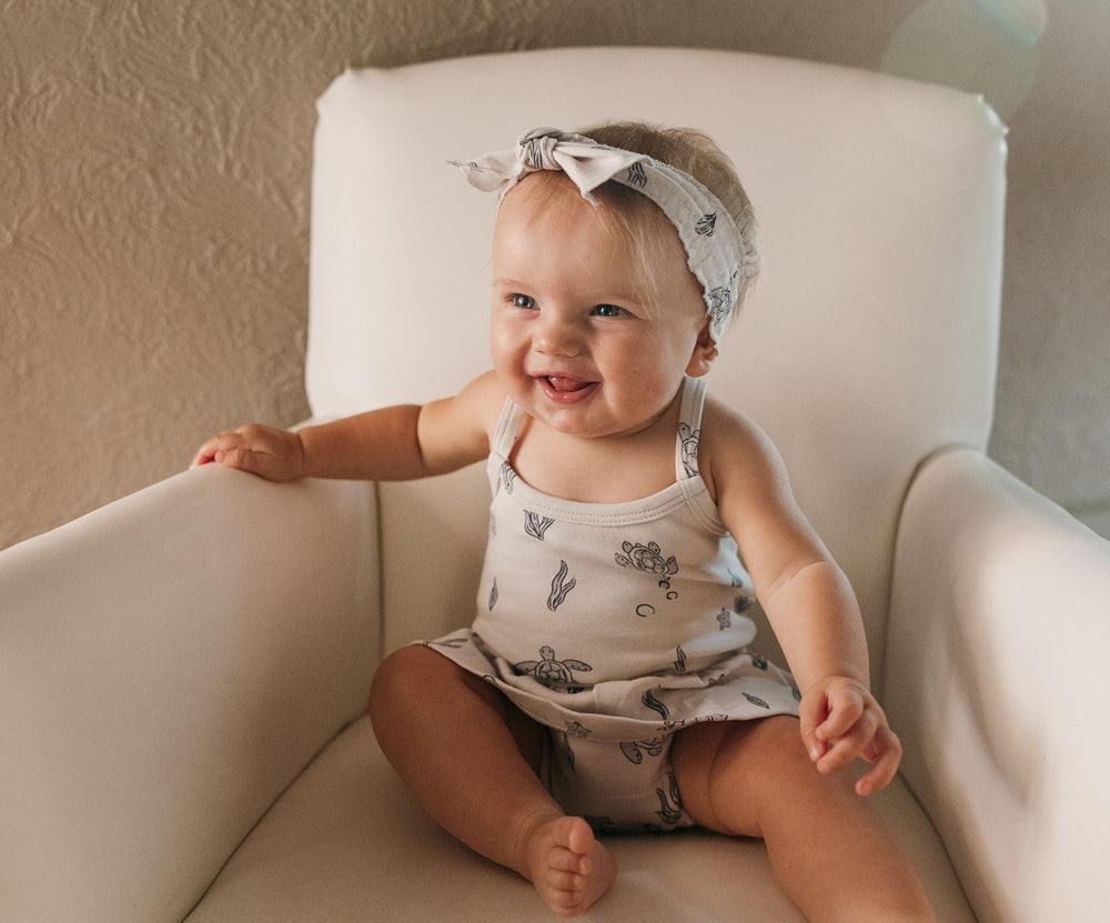 Child wearing Organic Smocked Headband in Sea Turtle.