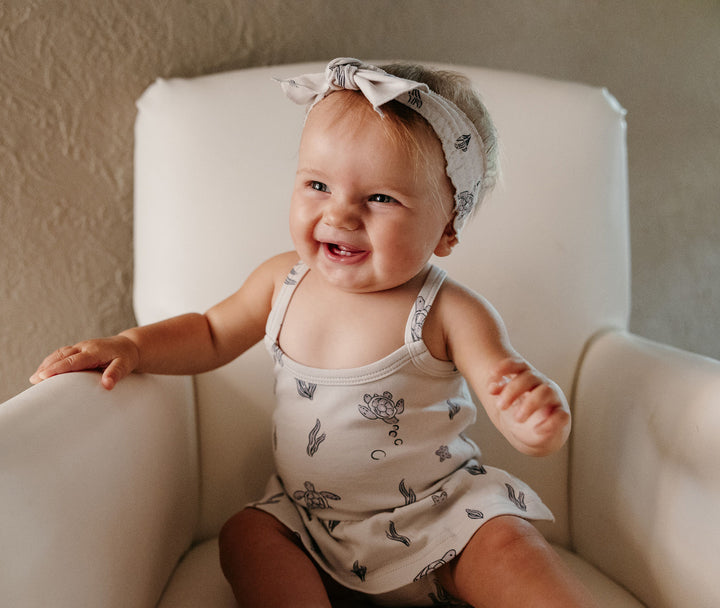 Child wearing Organic Smocked Headband in Sea Turtle.