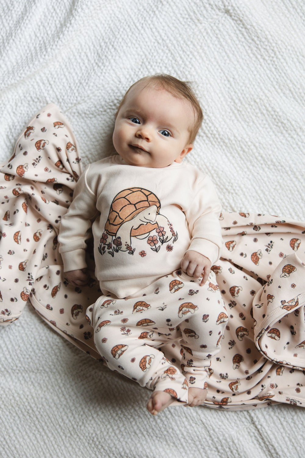 Child wearing Organic Sweatshirt & Jogger Set in Tiny Tortoise.