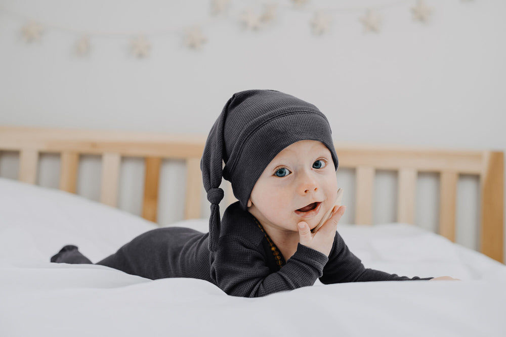 Child wearing Organic Thermal Knotted Cap in Coal