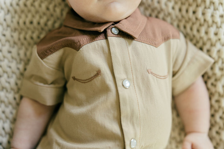 Child wearing Organic Western S/Sleeve Coverall in Oatmeal.