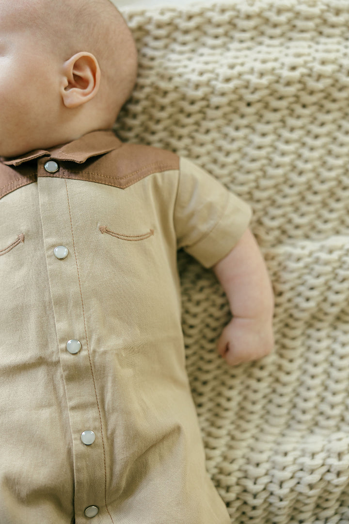 Child wearing Organic Western S/Sleeve Coverall in Oatmeal.