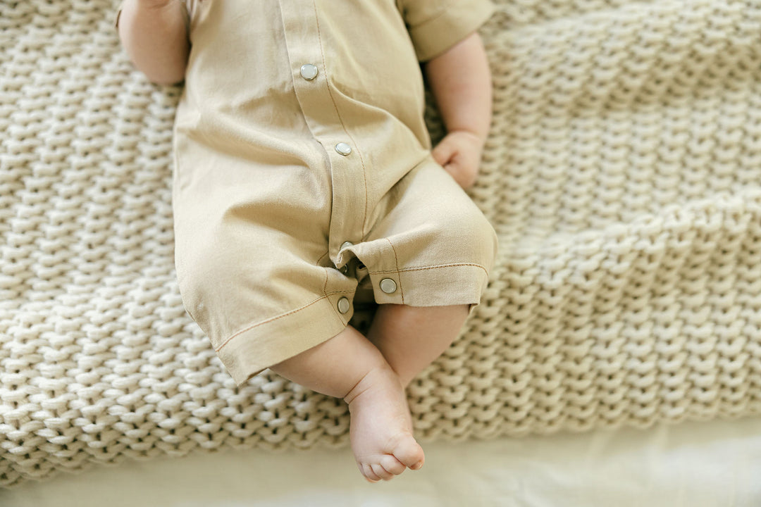 Child wearing Organic Western S/Sleeve Coverall in Oatmeal.