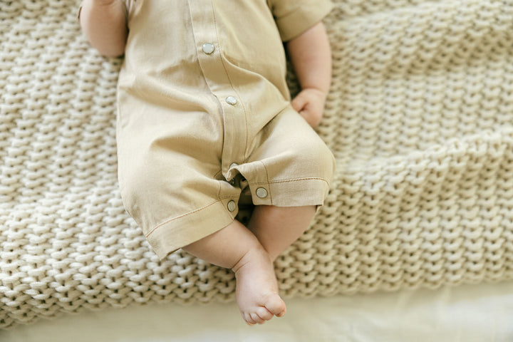 Child wearing Organic Western S/Sleeve Coverall in Oatmeal.