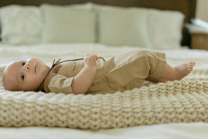 Child wearing Organic Western S/Sleeve Coverall in Oatmeal.
