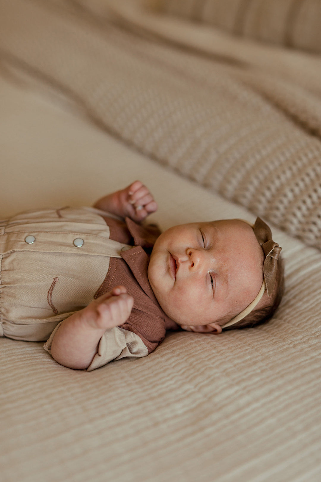 Child wearing Organic Western Romper in Oatmeal.